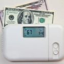 Thermostat showing 67 degrees with U.S. dollar bills, representing HVAC costs by Easco Air Conditioning and Heating.