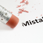 Pink eraser with "Mistake" text on white paper, related to HVAC tips by Easco Air Conditioning.