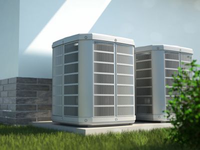 Air conditioning units in a well-maintained outdoor setting, emphasizing efficiency and longevity for homeowners' comfort.
