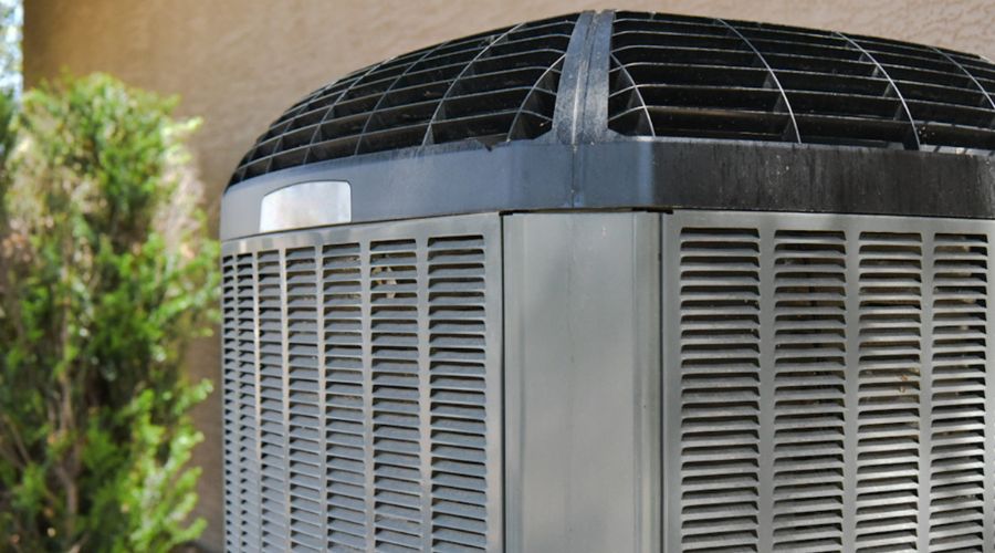Air conditioning unit outdoors, showcasing efficient design and maintenance considerations, relevant to air conditioner replacement guidance.